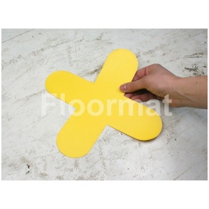 A person holding a yellow X Pallet Floor Marker on a white surface.